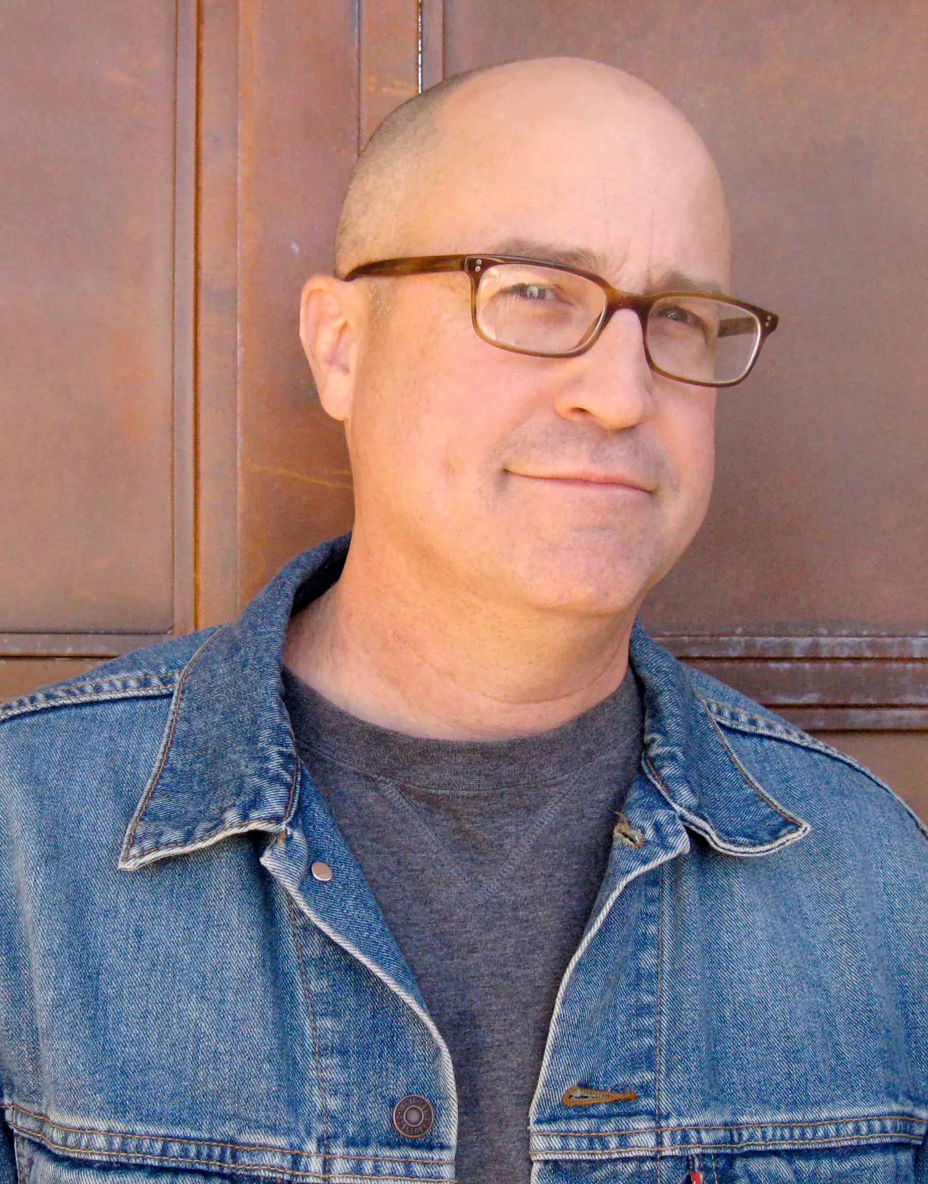 Portrait of author Chris Gall smiling outdoors