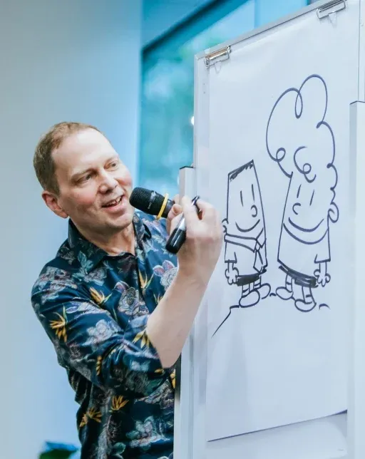 Portrait of author Dav Pilkey smiling in a casual setting