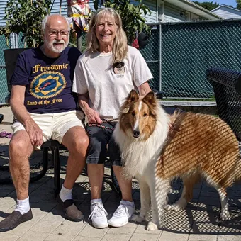 Rainier with his new family, Barb and Lou, at their home