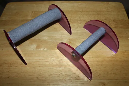 Range of low T-perches screwed into perspex sides for safety