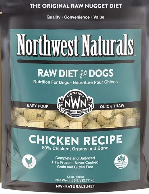 Raw chicken chunks with bone and organs, alongside vibrant vegetables like broccoli and carrots, representing Northwest Naturals dog food ingredients.