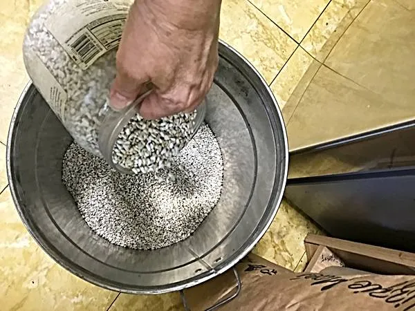 Re-using a Trail Mix Jar as a Seed Scoop