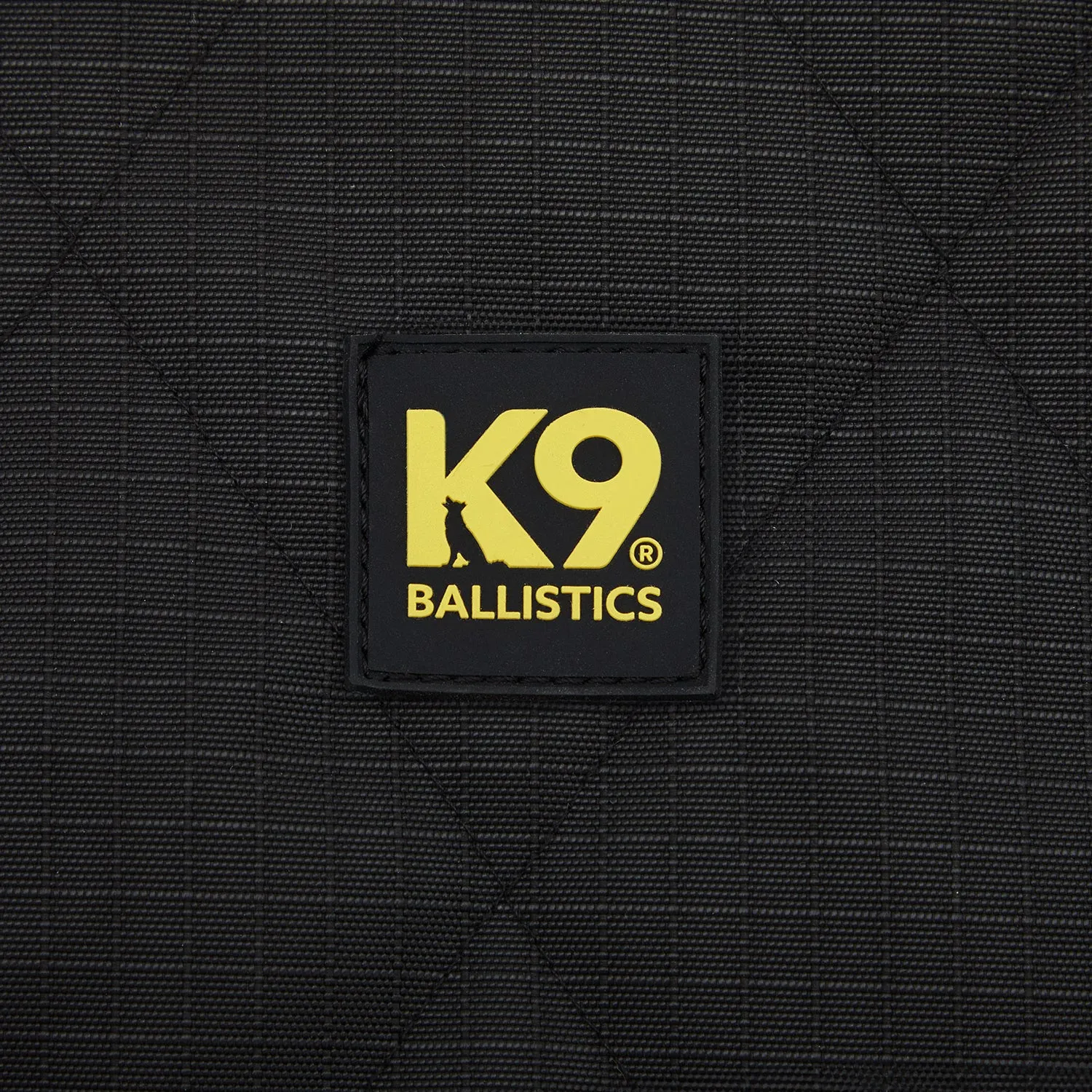 Rear view of an installed heavy-duty dog seat cover, showcasing its hammock design and side flaps