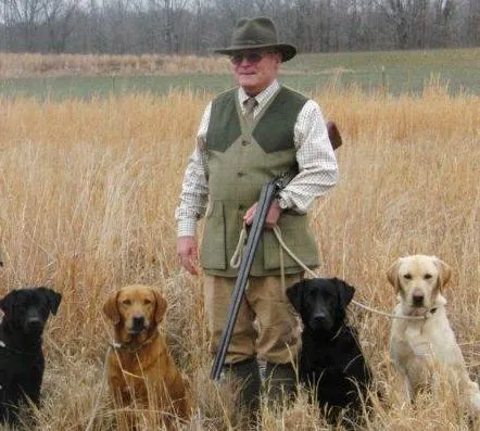 Robert Milner, a renowned gundog trainer, with one of his British Labrador Retrievers