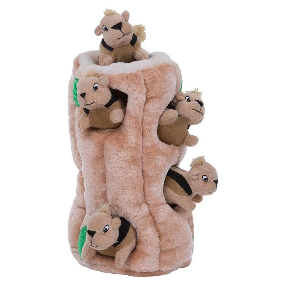 Six squeaky squirrels hidden within a plush fabric tree trunk puzzle for dogs