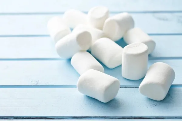 Soft white marshmallows laid out on a surface, ideal for hiding pills