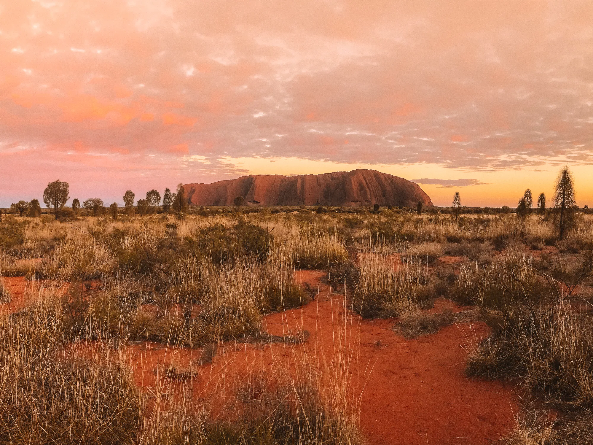 Sunrise over Uluru, a breathtaking ancient monolith.