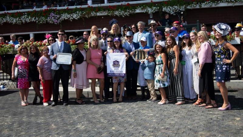 Trainer Carlos F Martin horse trainer celebrating with his champion mare Come Dancing after a major race win