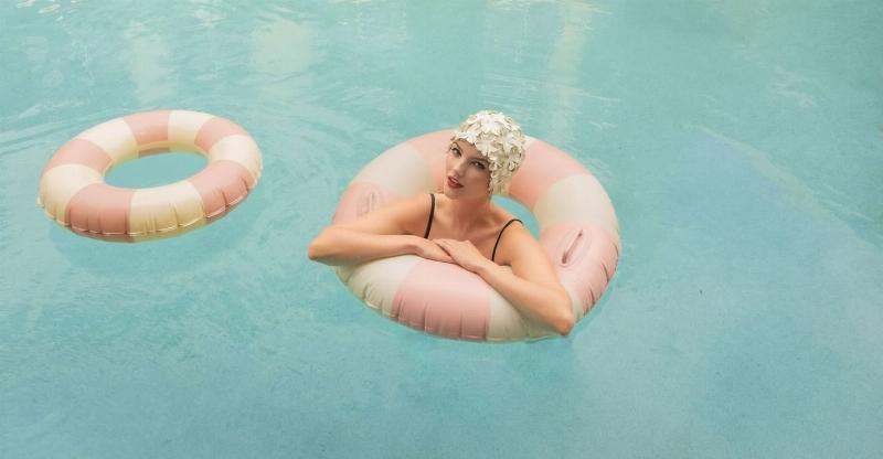 Close-up of a child's hands holding an open Little Golden Book featuring a dog, with a cozy, warm lighting