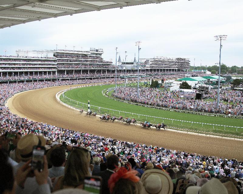 The iconic Twin Spires of Churchill Downs on a sunny Kentucky Derby day, showcasing one of the most famous horse racing tracks in the USA.