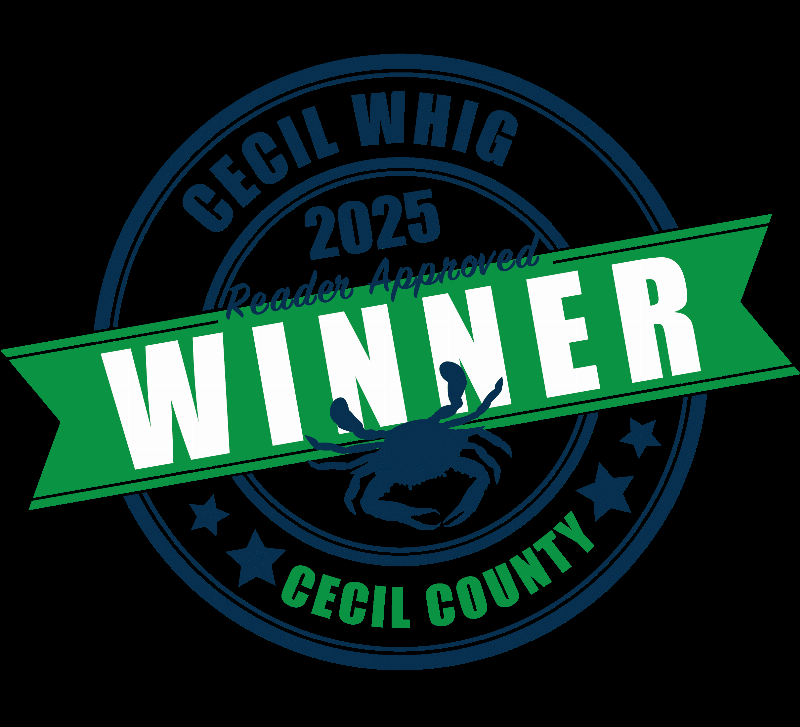 A happy puppy learning to sit during a training session in Elkton, MD.