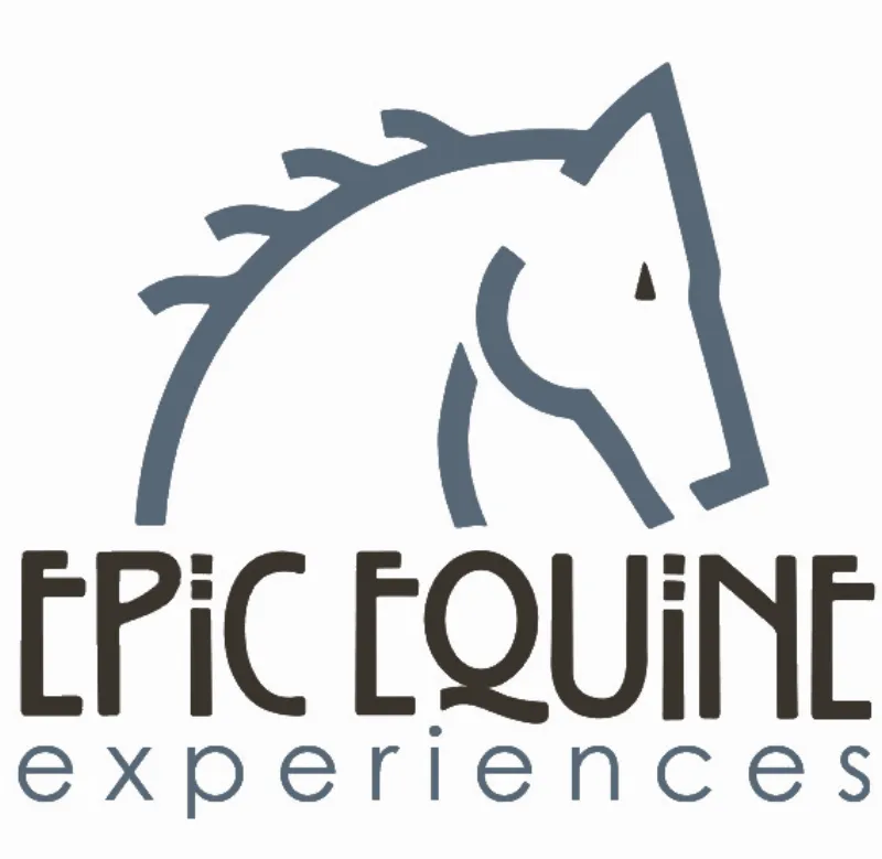 alt-text: Close-up of thoroughbred horses thundering down the track at Ellis Park, jockeys urging them on, kick up dust.