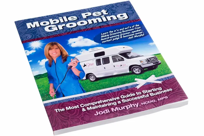 Comprehensive dog grooming book with various tools displayed