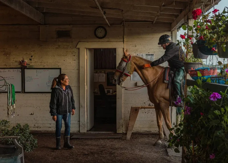 A black and white photo capturing a historic horse race finish at Golden Gate Fields