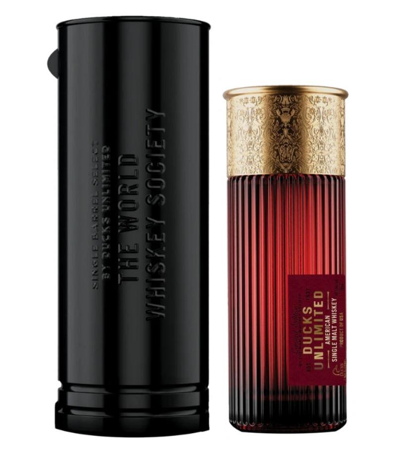 A close-up shot of the iconic Horse Soldier Bourbon bottle, emphasizing the metal emblem and the rich amber color of the whiskey inside.