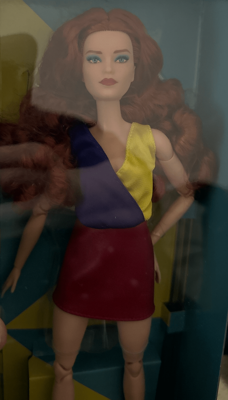 A curious dog looking at a rainbow-colored bone, symbolizing diversity and acceptance in pet relationships.