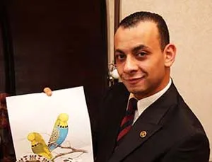 Moheb with his budgerigars