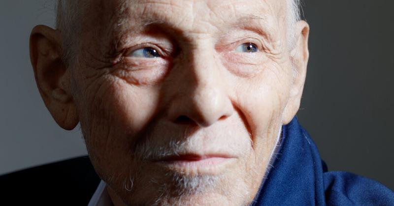 A close-up shot of a person thoughtfully solving a New York Times crossword puzzle, illustrating the popular and clever wordplay involved.