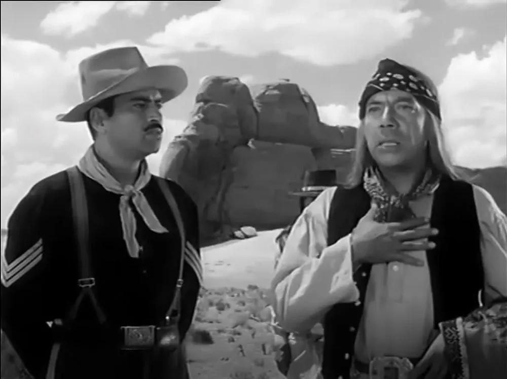 Sergeant Beaufort (Pedro Armendáriz) translates Chief Cochise’s words in Spanish for the Cavalry party.