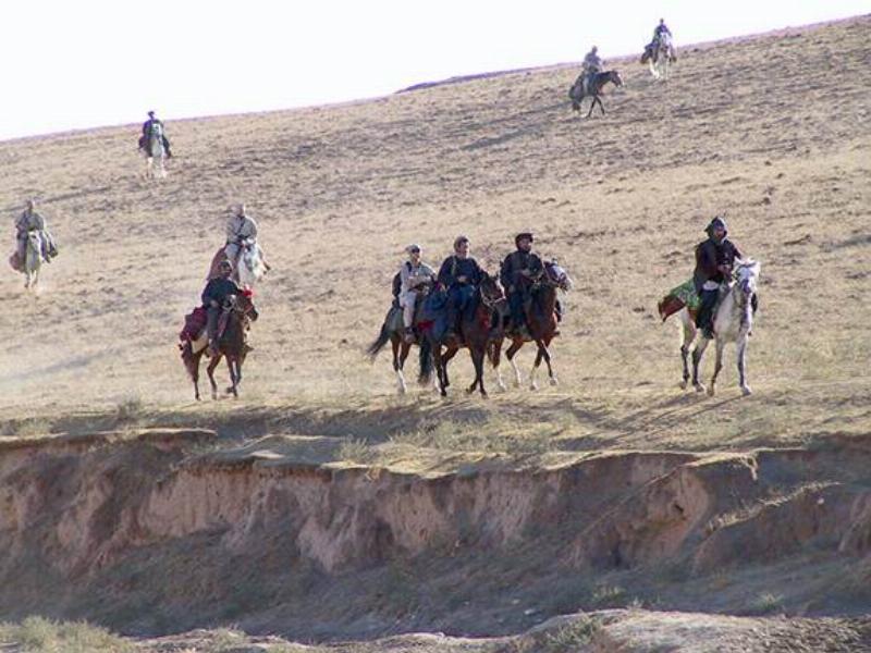 The true story of the 12 Strong horse soldiers, showing the Green Berets of ODA 595 riding horses in the harsh mountains of Afghanistan.