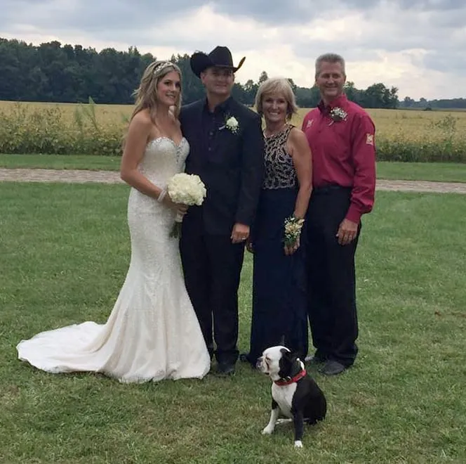 Bride walking down the aisle with dog