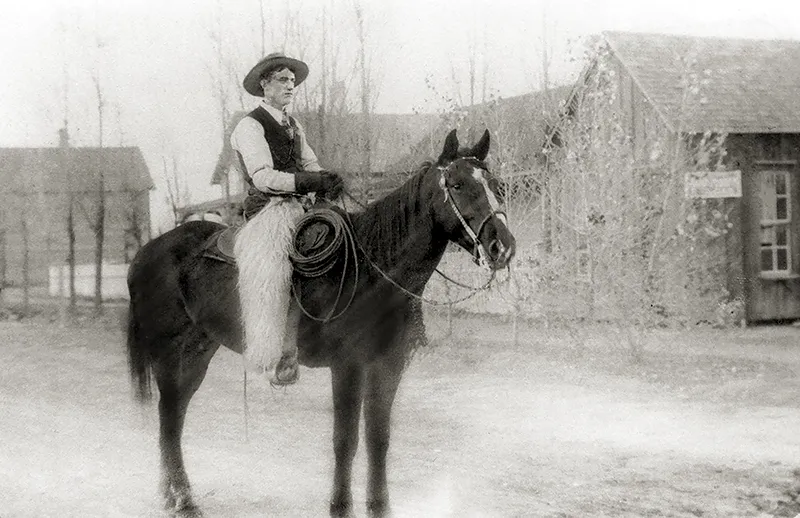 Joe Black in 1900 using a silver spade bit, rawhide reata, and woolly chaps.